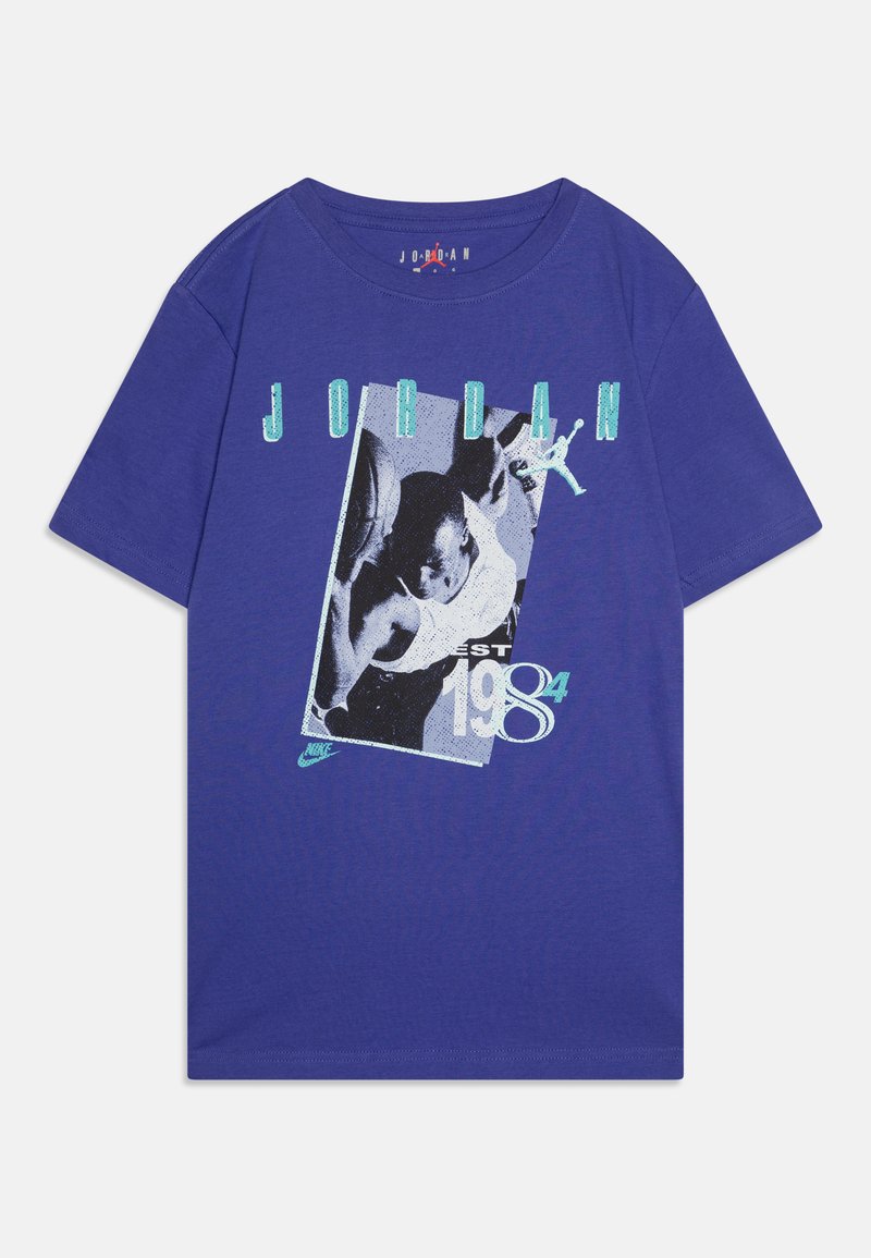 Purple cotton t-shirt featuring a graphic design with "JORDAN" and "EST 1984," including an image of a basketball player in action.