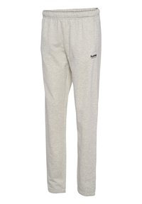 Ljusgrå sweatpants med elastiskt midjeband, sidofickor och en liten svart logotyp på övre vänstra sidan, tillverkade av mjukt tyg.