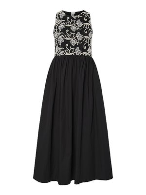 Black dress with a fitted embroidered bodice featuring floral patterns. The skirt is full and pleated, made of lightweight fabric.