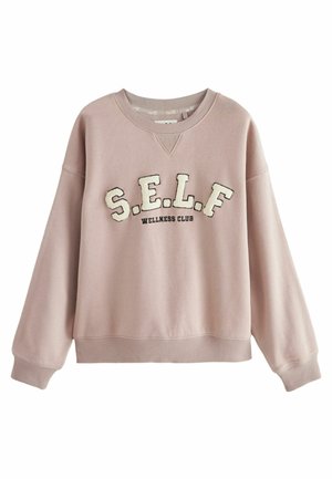 Light pink sweatshirt made of soft fabric. Features ribbed cuffs and hem, with “S.E.L.F. WELLNESS CLUB” embroidered in contrasting colors.
