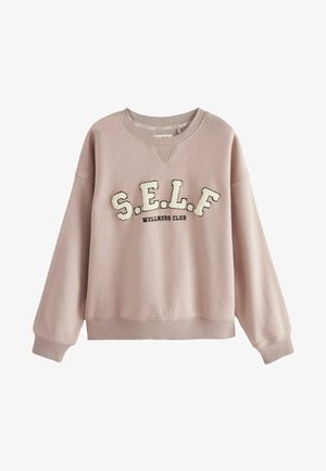 Vaaleanpunainen collegemekko, joka on valmistettu pehmeästä kankaasta. Varustettu joustaviin hihansuihin ja helmaan, joissa on kirjailtuna erivärisinä "S.E.L.F. WELLNESS CLUB".