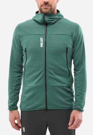 Green hooded jacket with a textured pattern, front zip, two side pockets, and a logo on the upper left chest. Long sleeves complete the design.