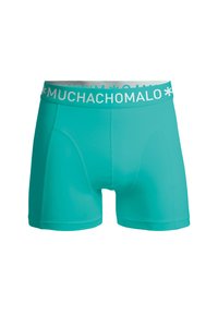 Akvasto modri bokserji s plaventim pasom z belim logotipom "MUCHACHOMALO", gladke teksture, prilegajoče oblike, brez vidnih vzorcev ali dodatkov.