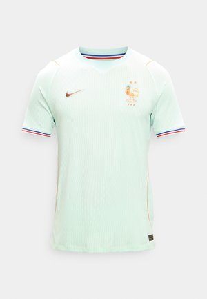 Francia futballmez világoszöldben, arany Nike logóval és két csillaggal a kakas embléma felett, kék, fehér és piros szegéllyel az ujjakon.