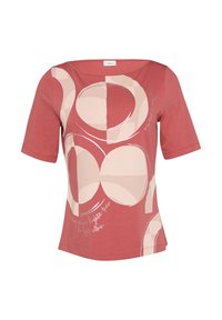 Röd T-shirt med korta ärmar, med en grafisk design av överlappande cirklar i ljusbeige och vitt, med text integrerad i mönstret.