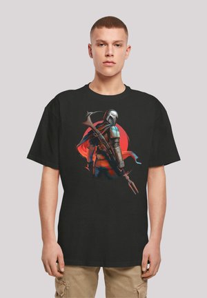 Black t-shirt featuring a colorful graphic of a character in armor, holding a weapon, set against a red circle backdrop. Short sleeves, casual fit.