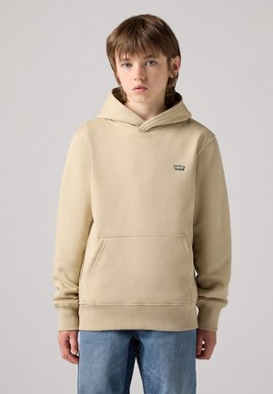 Felpa con cappuccio beige, dotata di tasca a canguro e polsini a costine. Piccolo patch con logo sul petto, realizzata in morbido tessuto testurizzato.