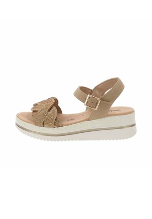 Sandal in beige con piattaforma, tomaia texturizzata, fiocco decorativo, cinturino alla caviglia regolabile e soletta imbottita. Suola in gomma con dettagli antiscivolo.