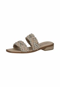 Sandali piatti beige con due cinghie intrecciate adornate da piccole pietre preziose, dotati di una soletta liscia e tacco basso.
