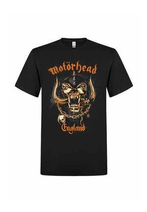 Schwarzes T-Shirt mit orangefarbenem "Motörhead" und "England" Schriftzug, zeigt einen fauchenden gehörnten Totenschädel mit Stoßzähnen, Ketten und einem kleinen Totenschädel-Anhänger.