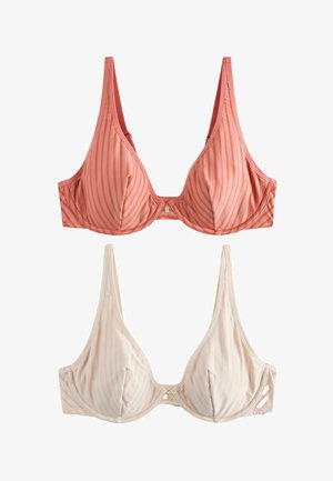 To bøjle-bh'er med lodrette prikkede striber, en i koralpink og en i lysebeige, vist på hvid baggrund.