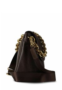 Brown leather handbag with a textured surface, gold chain hardware, and a fabric shoulder strap. Side view highlighting design and materials.