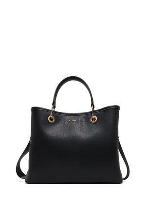 Sac à main Aldo en cuir noir avec doubles anses supérieures, œillets métalliques dorés et petite bandoulière sur fond blanc.