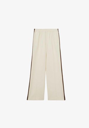 Beige brede bukser med elastisk talje, der har mørkebrune sidelister og forlommer. Glat stof med en afslappet pasform.