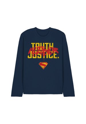 Navy long-sleeve shirt with yellow "Truth Justice" text crossed out by red "Whatever" graffiti and a small red and yellow Superman emblem below.