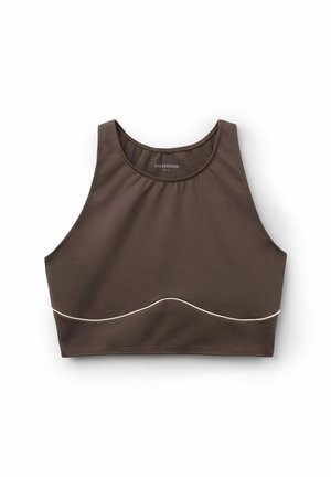 Brown athletic crop top made from smooth fabric, featuring a rounded neckline and a contrasting white curved accent along the hem.
