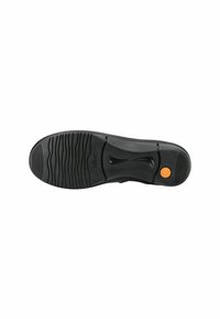 Suela de zapato de goma negra con un diseño de banda de rodadura en patrón de ola y un acento circular naranja. Textura suave con un diseño contorneado en el centro.