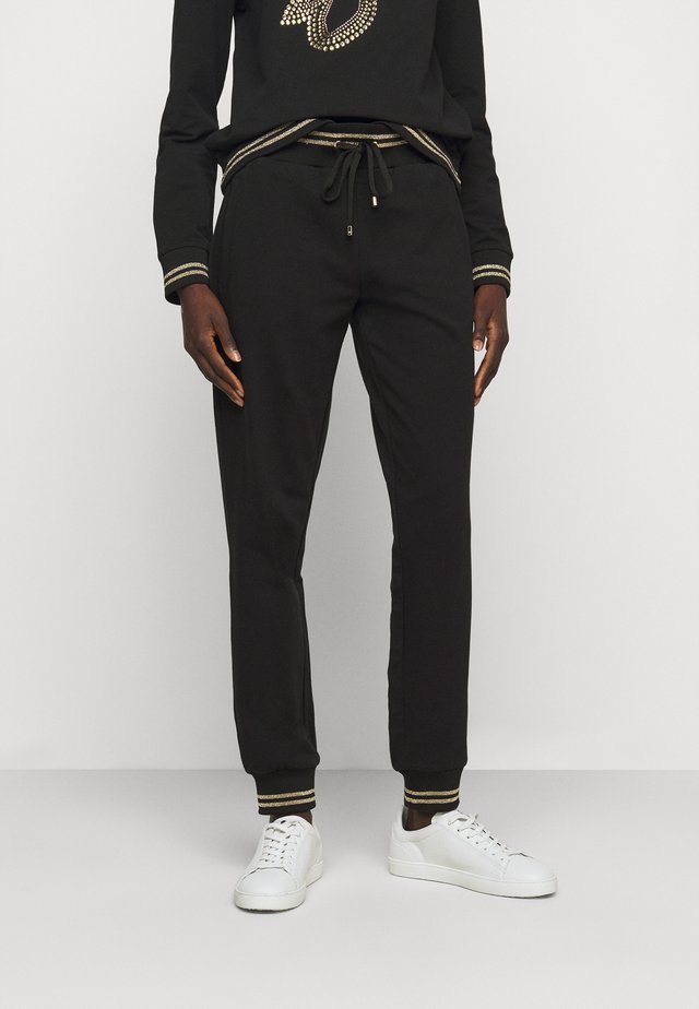 JOGGER - Spodnie treningowe - nero/gold