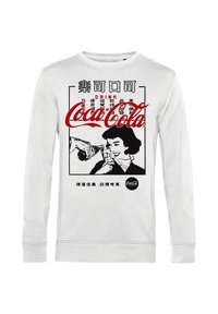 Felpa bianca a maniche lunghe con una grafica retrò della Coca-Cola. Il design include testo nero e un'illustrazione di una donna che beve da una bottiglia.