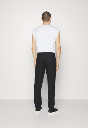 KARL - Trousers - black