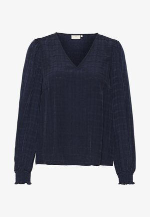 Marineblauwe blouse met V-hals, textuurstof, lange mouwen met gathering details bij de manchetten en een relaxte pasvorm. Glad afwerking.