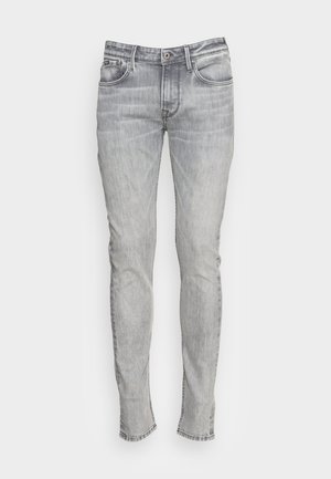 Slim-fit grijze denimjeans met vijf zakken, een knoopsluiting en contrasterende stiksels. De stof heeft een licht vervaagde en gestructureerde uitstraling.
