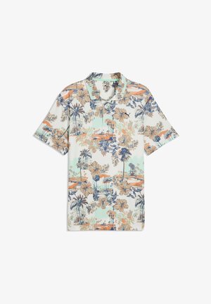 Polo a maniche corte con motivo floreale di palme in blu, pesca e menta su sfondo bianco. Realizzata in tessuto leggero.