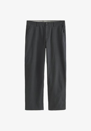 Tumed hallid püksid, mis on valmistatud puuvillasegistusest. Omavad kahte esist taskut, vöörihmu ning nööbiga sulgumist ja tõmbluku avamist. Sirge lõikega disain.