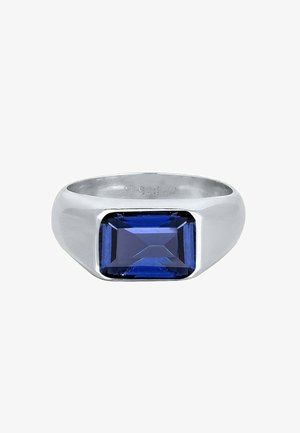 Bague en argent avec une pierre précieuse rectangulaire bleu profond sertie au centre, marquée "925 Ag" à l'intérieur de l'anneau.