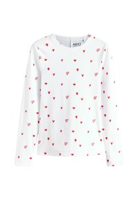 Weißes Langarmshirt mit Rundhalsausschnitt, gemustert mit kleinen roten Herzen, aus weichem Stoff mit strukturierter Oberfläche.