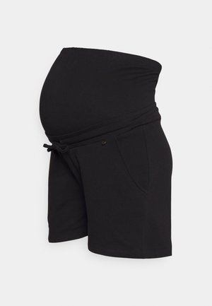 Calças de maternidade pretas feitas de um tecido suave, com uma cintura larga e elástica, detalhes de laço e bolsos laterais.