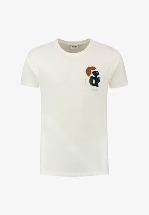 Kreemivärvi puuvillane t-särk, millel on ümar kaelus ja lühikesed varrukad. Rinnal on märkimisväärne tumeroheline, pruun ja must kiri.