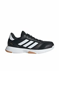 Chaussure de sport Adidas Ligra noire et blanche avec trois bandes blanches, design à lacets et semelle blanche épaisse avec accents marron.