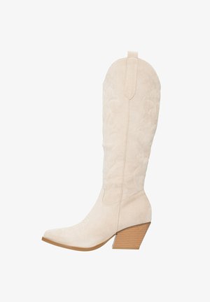 Beige suede cowboy boots with embroidered detail, pointed toe, and a stacked block heel, featuring a pull tab at the top.