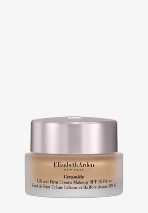 Elizabeth Arden Ceramide Lift and Firm Cream Makeup SPF 15 in mattiertem Glasbehälter mit metallisch pinkfarbenem Deckel vor weißem Hintergrund.