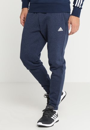 Marineblaue sportliche Jogginghose mit strukturierter Oberfläche, elastischem Bund und weißem Adidas-Logo auf dem linken Oberschenkel.