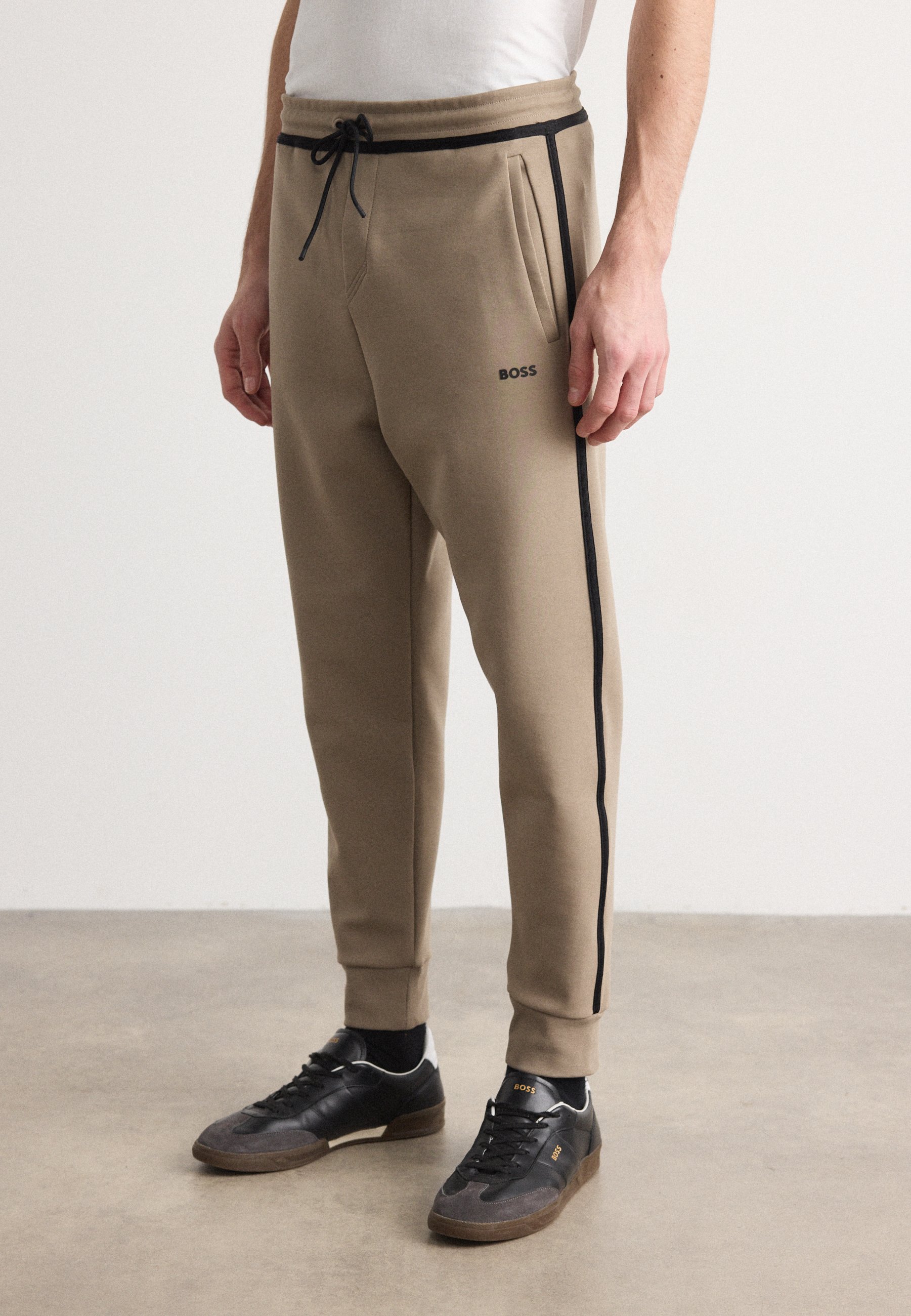 BOSS HADIKO TAPE - Tracksuit bottoms - light pastel green/light 