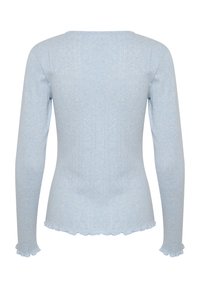 Světle modrý dlouhý rukáv top s žebrovanou strukturou, jemnými detaily a vlnitým lemem na manžetách a spodním okraji.