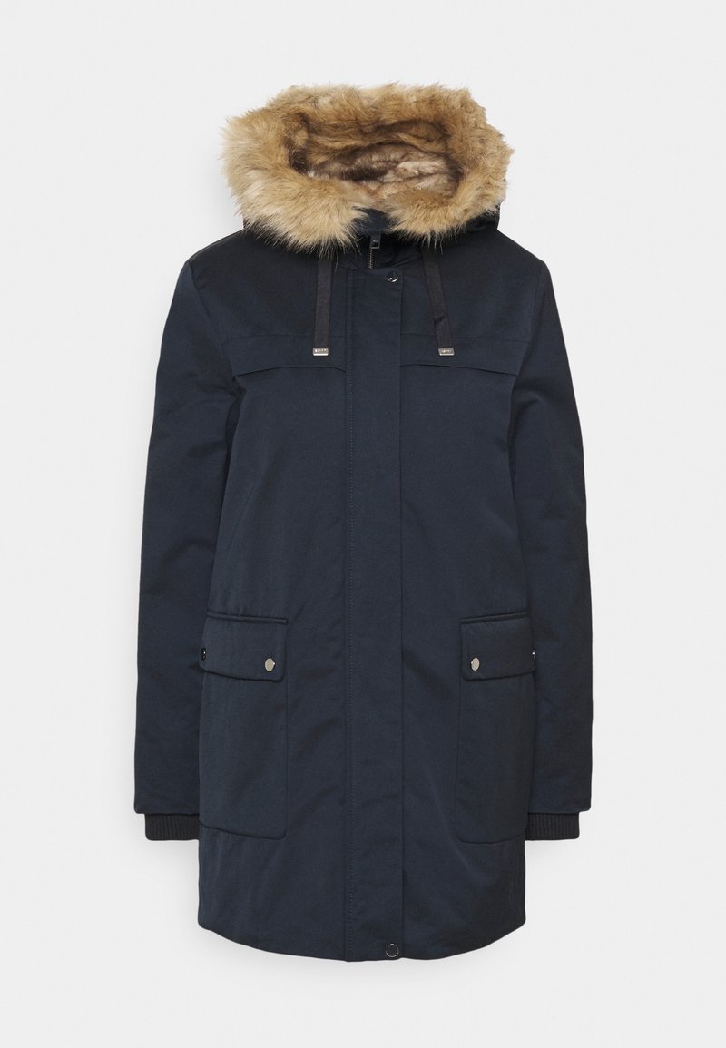 Manteau d'hiver bleu marine avec capuche bordée de fourrure, fermeture éclair avant et boutons-pression, deux grandes poches avant à rabat, et poignets côtelés.