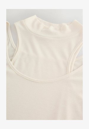 Rippenshirt ohne Ärmel in sanfter Cremfarbe mit hohem Halsausschnitt und runden Armlöchern. Der Stoff hat ein glattes, texturiertes Aussehen.