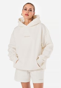 Pegador CLARITA - Camisola - washed warm white gum