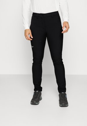 Black athletic pants made of stretch fabric, featuring a zipper pocket and a small logo on the left thigh, slim-fit design.
