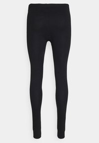 Black leggings made of stretch fabric, featuring a smooth texture, form-fitting design, and ankle-length finish without prominent seams or details.