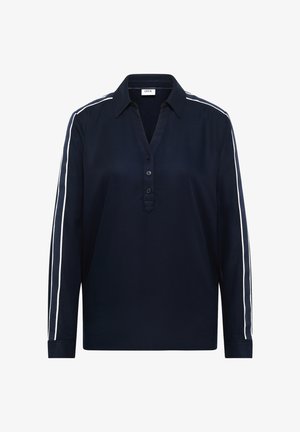 Marinblå pikétröja med lång ärm och knäppning framtill, med vita sidostrippar och krage. Mjukt tyg med avslappnad passform.