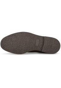 Suola della scarpa con superficie testurizzata, prevalentemente marrone scuro, caratterizzata da un design spesso e rigato per una maggiore aderenza e durata.
