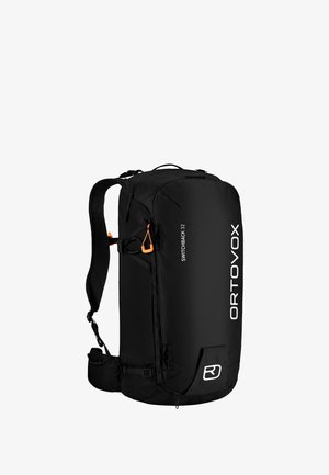Black backpack with a sleek design, featuring a textured surface, adjustable straps, mesh details, and an orange accent clip.