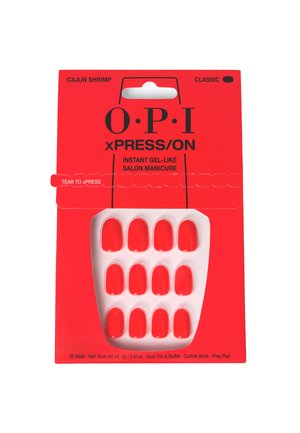 Un emballage rouge avec le texte "O.P.I" présente un plateau de 12 faux ongles rouge vif. Comprend de la colle à ongles et des outils pour l'application.