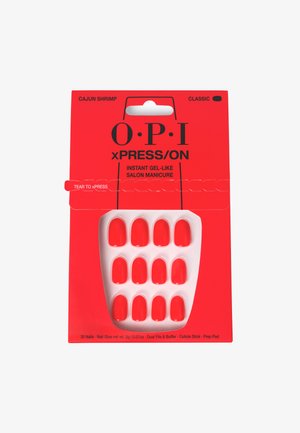 Un emballage rouge avec le texte "O.P.I" présente un plateau de 12 faux ongles rouge vif. Comprend de la colle à ongles et des outils pour l'application.