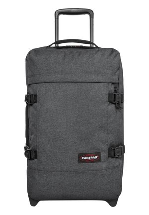 Grey wheeled backpack with a textured fabric finish, front compression straps, a retractable handle, and a branded logo patch.