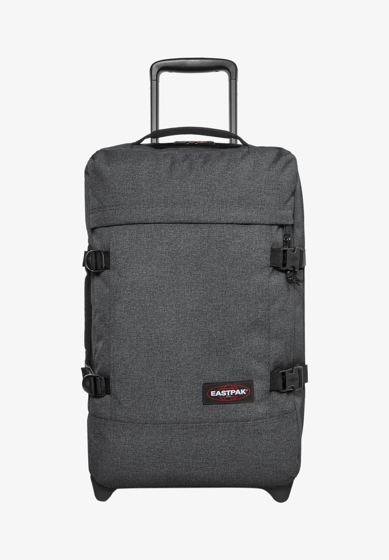 Šedý kolečkový batoh s texturovaným povrchem, předními kompresními popruhy, vysouvací rukojetí a logem výrobce na nášivce.